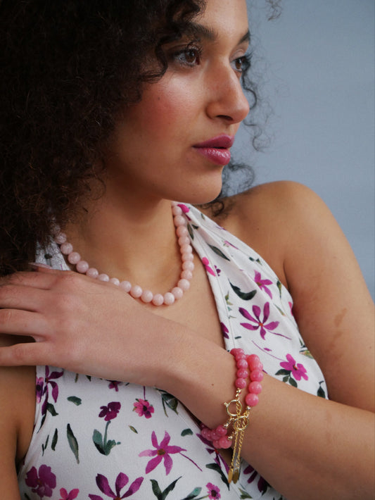 Curled hair model  floral shirt crystal jade pink  necklace and 14K gold bracelet