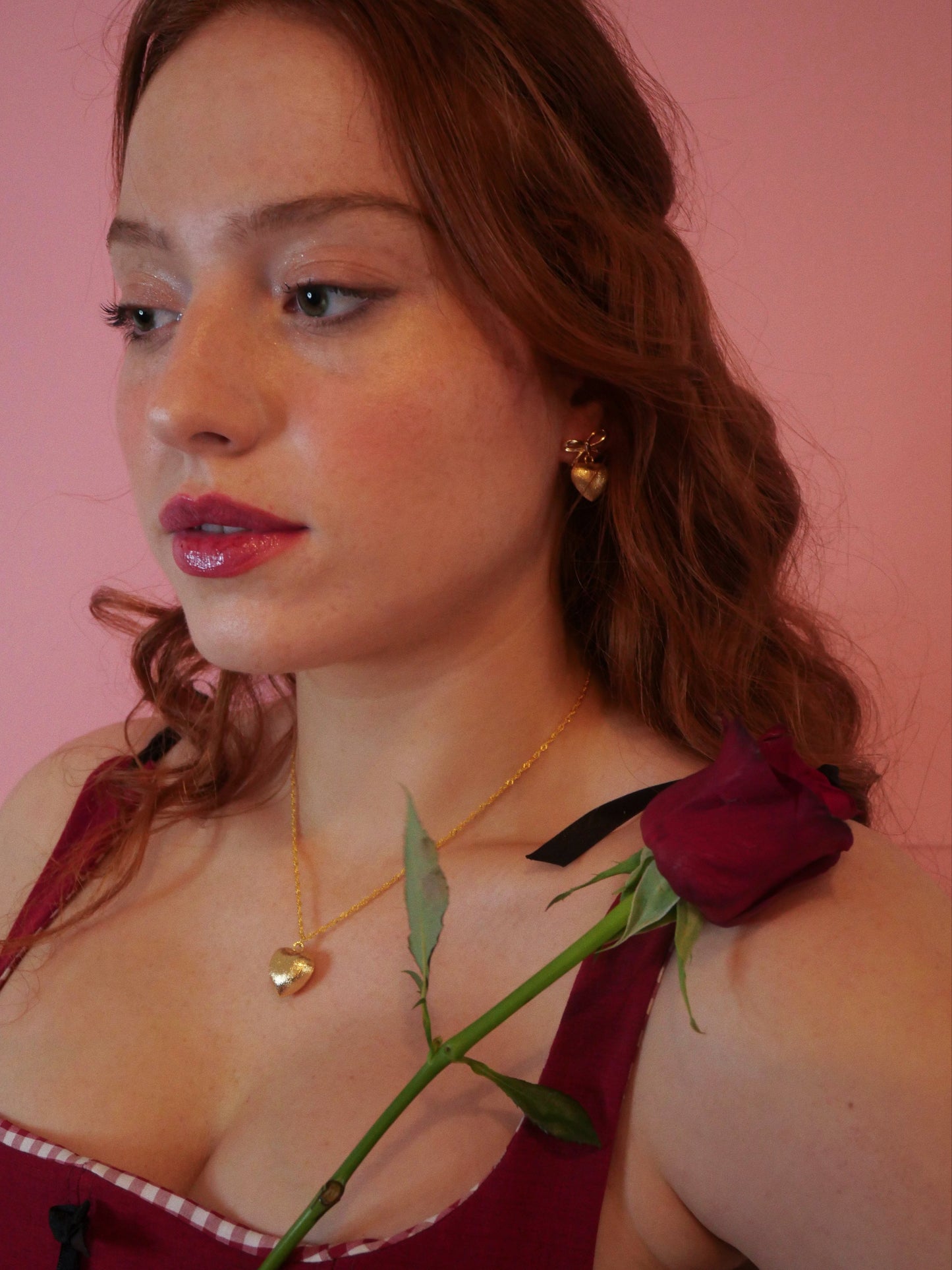 redhead model Red corset red rose 14K gold heart earrings and 14k gold necklace gold heart pendent