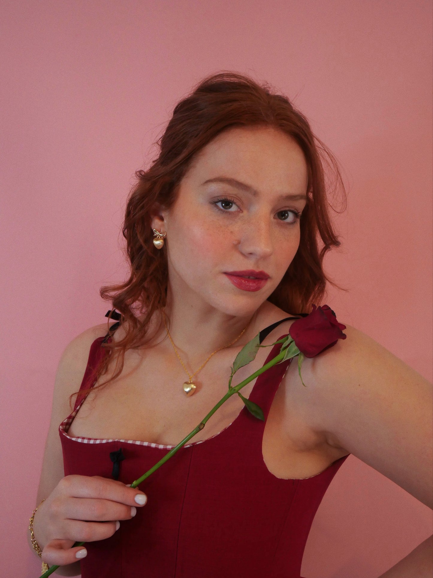 redhead model Red corset red rose 14K gold heart earrings and 14k gold necklace gold heart pendent