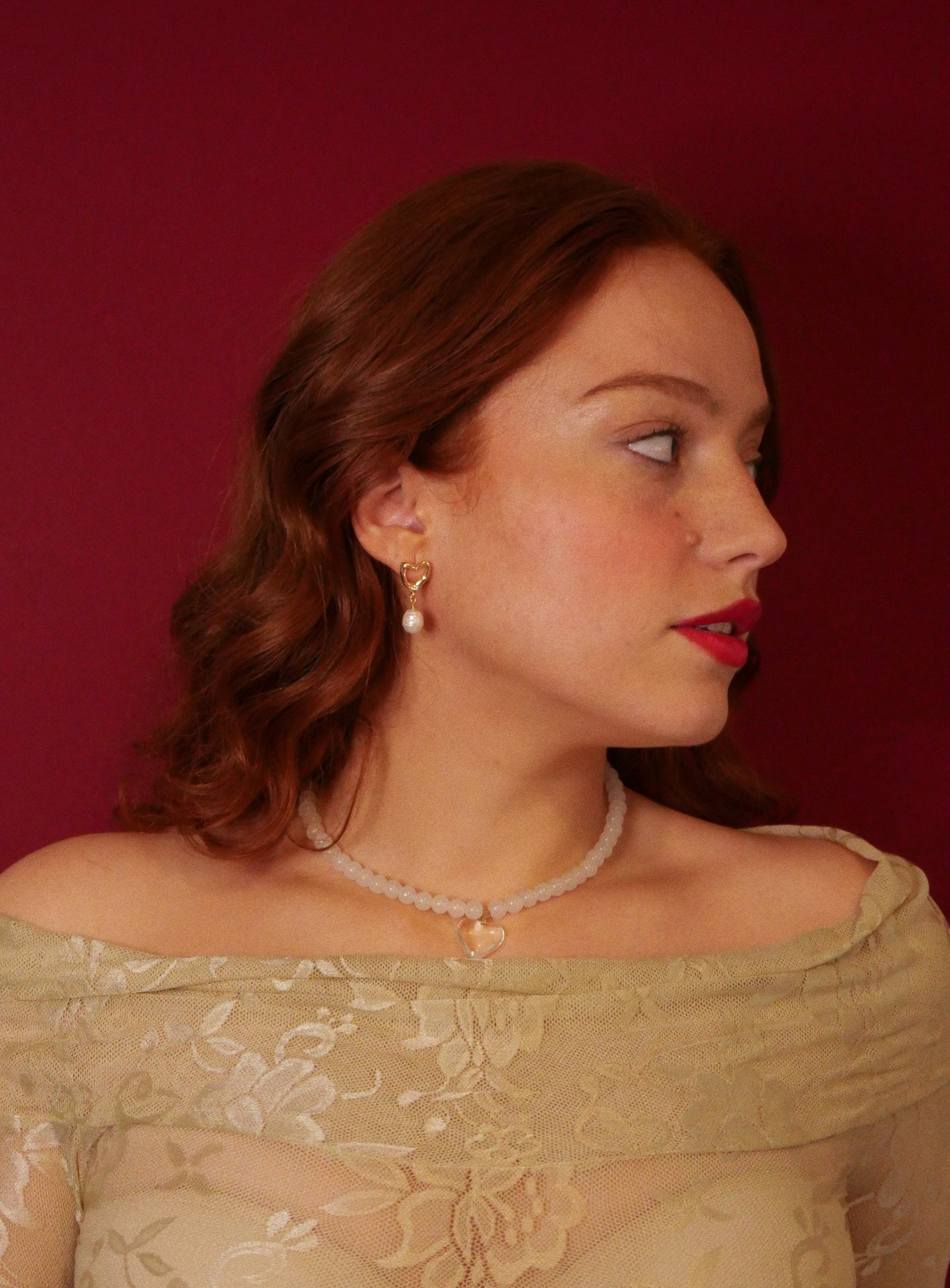 redhead model lace shirt 14K gold earrings with white pearl crystal necklace with heart pendent